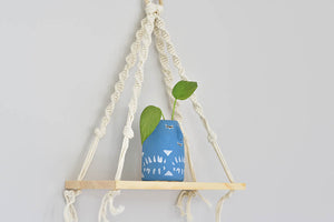 Macrame hanging plant holder with shelf